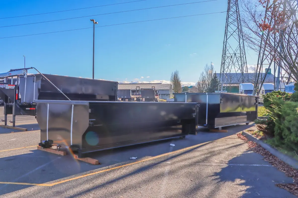 Roll-off dumpster ready for waste disposal at job site for Concrete Dumpster Rental in Boston
